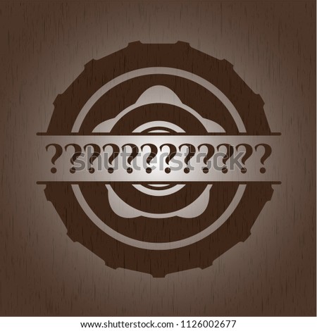 Question Mark badge with wood background