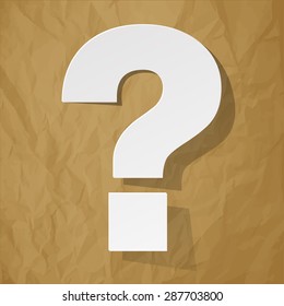 question mark on a crumpled paper brown background