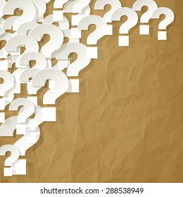 question marks in the corner on a crumpled paper brown background
