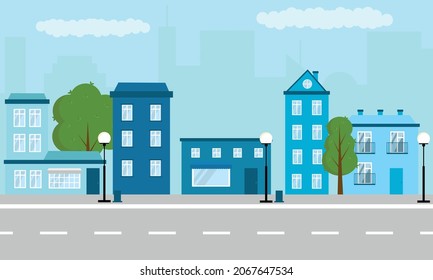 Quiet street in the city. Blue houses on the street. Small town. Street for the background. City for the background. Street without cars.