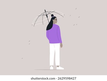 In a quiet urban environment, a person standing under a transparent umbrella as droplets of rain fall around them, fostering a sense of safety amidst the wet weather