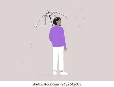 In a quiet urban environment, a person standing under a transparent umbrella as droplets of rain fall around them, fostering a sense of safety amidst the wet weather