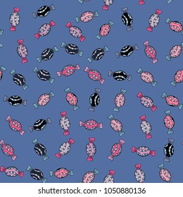 Quirky, abstract hand drawn seamless vector candy pattern. Colorful, retro hand illustrated Halloween treats on a blue, black and neutral background.