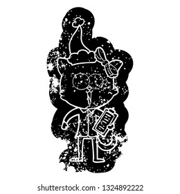quirky cartoon distressed icon of a cat wearing santa hat