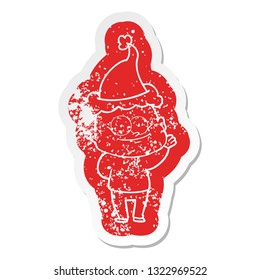 quirky cartoon distressed sticker of a bald man staring wearing santa hat