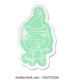 quirky cartoon distressed sticker of a bored lion wearing santa hat