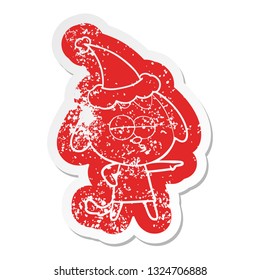 quirky cartoon distressed sticker of a bored dog wearing santa hat