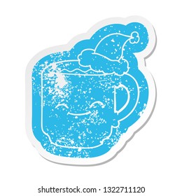quirky cartoon distressed sticker of a coffee mug wearing santa hat