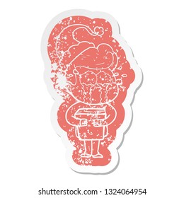 quirky cartoon distressed sticker of a crying man holding book wearing santa hat
