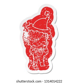 quirky cartoon distressed sticker of a girl wearing futuristic clothes wearing santa hat
