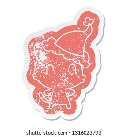 quirky cartoon distressed sticker of a happy cat wearing santa hat