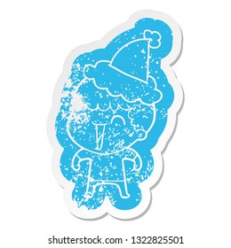 quirky cartoon distressed sticker of a happy man wearing santa hat