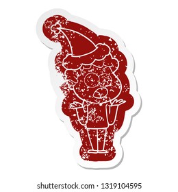 quirky cartoon distressed sticker of a man gasping in surprise wearing santa hat