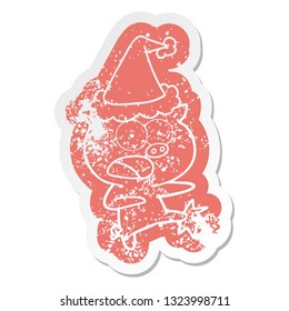 quirky cartoon distressed sticker of a pig shouting and kicking wearing santa hat