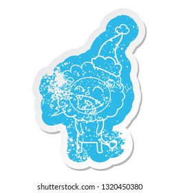 quirky cartoon distressed sticker of a roaring lion wearing santa hat