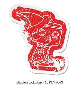 quirky cartoon distressed sticker of a robot wearing santa hat