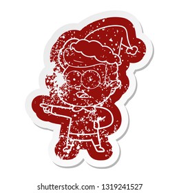 quirky cartoon distressed sticker of a staring man wearing santa hat
