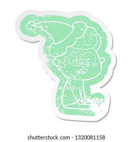 quirky cartoon distressed sticker of a staring man wearing santa hat