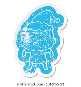quirky cartoon distressed sticker of a tired bald man wearing santa hat