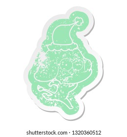 quirky cartoon distressed sticker of a unsure elephant running away wearing santa hat