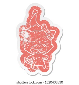 quirky cartoon distressed sticker of a yawning cat wearing santa hat