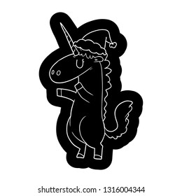 quirky cartoon icon of a unicorn wearing santa hat