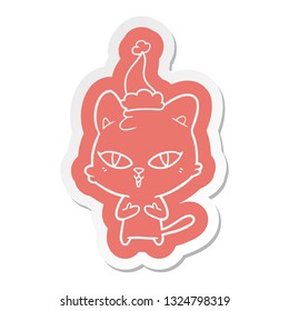quirky cartoon  sticker of a cat wearing santa hat
