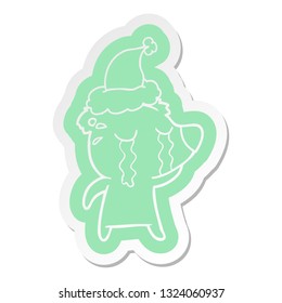 quirky cartoon  sticker of a crying bear wearing santa hat