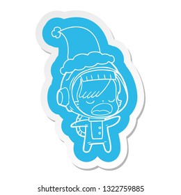 quirky cartoon  sticker of a talking astronaut woman wearing santa hat