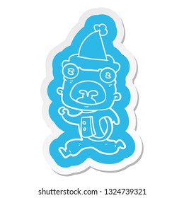 quirky cartoon  sticker of a weird alien running away wearing santa hat