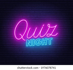 Quiz Night neon sign on brick wall background.