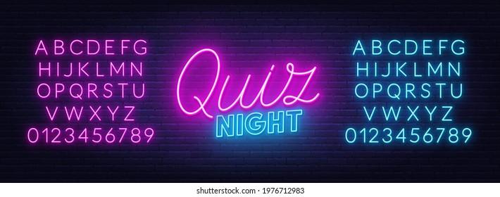 Quiz Night neon sign on brick wall background.