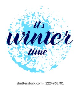 Quote about winter. Winter lettering. It's winter time. Hand lettered. Blue abstract background.