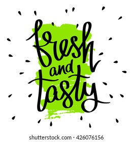 Quote "Fresh and tasty". Trendy calligraphy. Vector illustration on white background with green ink smear. Hand-drawn graphics.