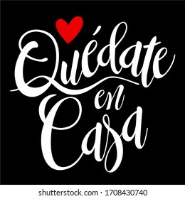 Quote in spanish "quedate en casa" (Stay at Home) white with red heart. isolated on black background. Social distancing campaign during quarentine COVID-19 pandemic