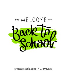 Quote "Welcome back to school." The trend calligraphy. Vector illustration on white background with green ink smear.