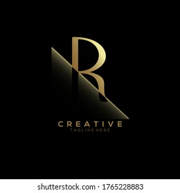 R Gold Letter Logo Design with Creative Paper Cut