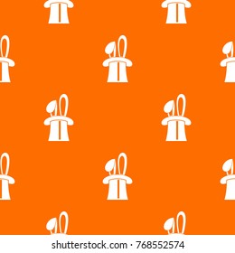 Rabbit appearing from a top magic hat pattern repeat seamless in orange color for any design. Vector geometric illustration