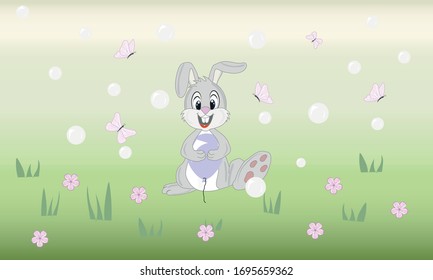 Un conejo con una bola en sus patas se pone sobre el césped en círculos de mariposas, burbujas, flores.