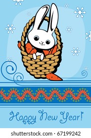 rabbit in a basket with carrots