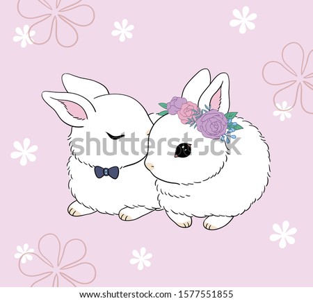 A rabbit with a bow tie on its neck is kissing another rabbit