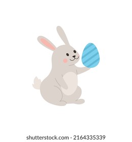 Rabbit or bunny running holding Easter egg, flat cartoon vector illustration isolated on white background. Easter bunny or rabbit funny springtime character.