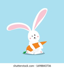 rabbit with carrot isolated on blue background.