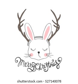 Rabbit with deer horns. Christmas card. Cute bunny and lettering