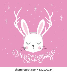 Rabbit with deer horns. Christmas card. Cute bunny and lettering