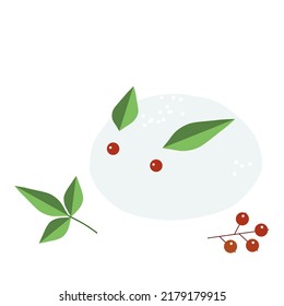 Rabbit doll made of snow, Nanten leaves and berries. Children's winter play.