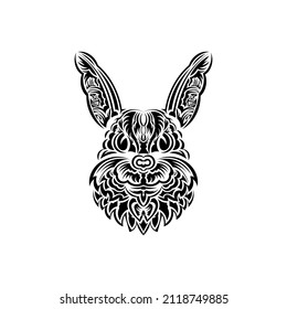 Rabbit head in Polynesian style. Isolated symbol of 2023. Handmade.