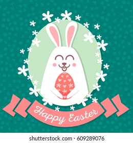 The rabbit holds an egg in his paws.
