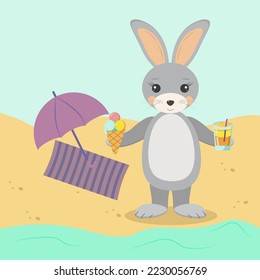 rabbit with ice cream and juice on the shore on the warm sand resting