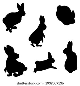 Rabbit icon set black. Silhouettes of rabbits in different poses. Vector isolated images on white background. Template for kids craft, wooden carwing, decor, stamps.